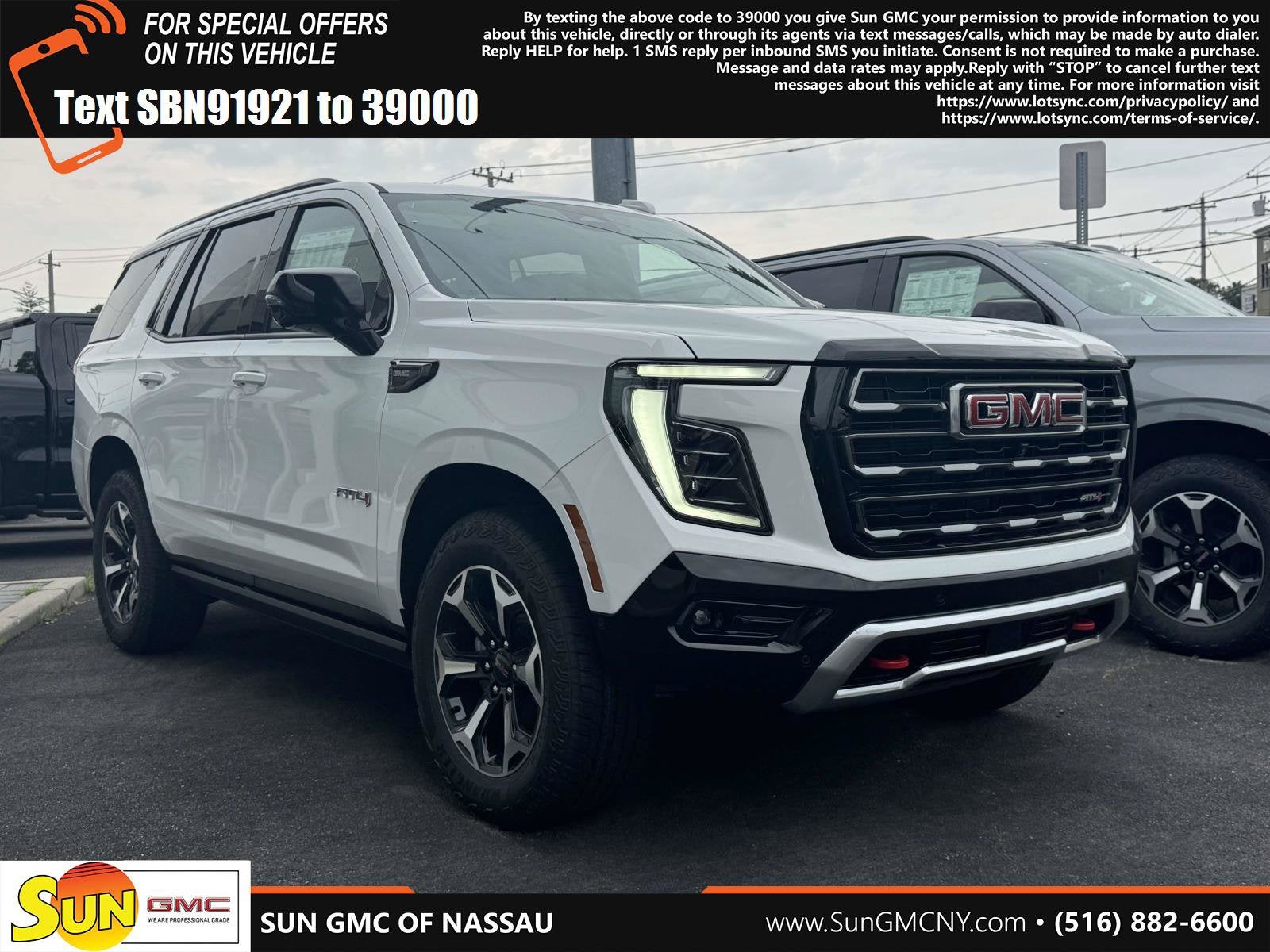 2026 GMC Yukon AT4 in Summit White — front three-quarter view