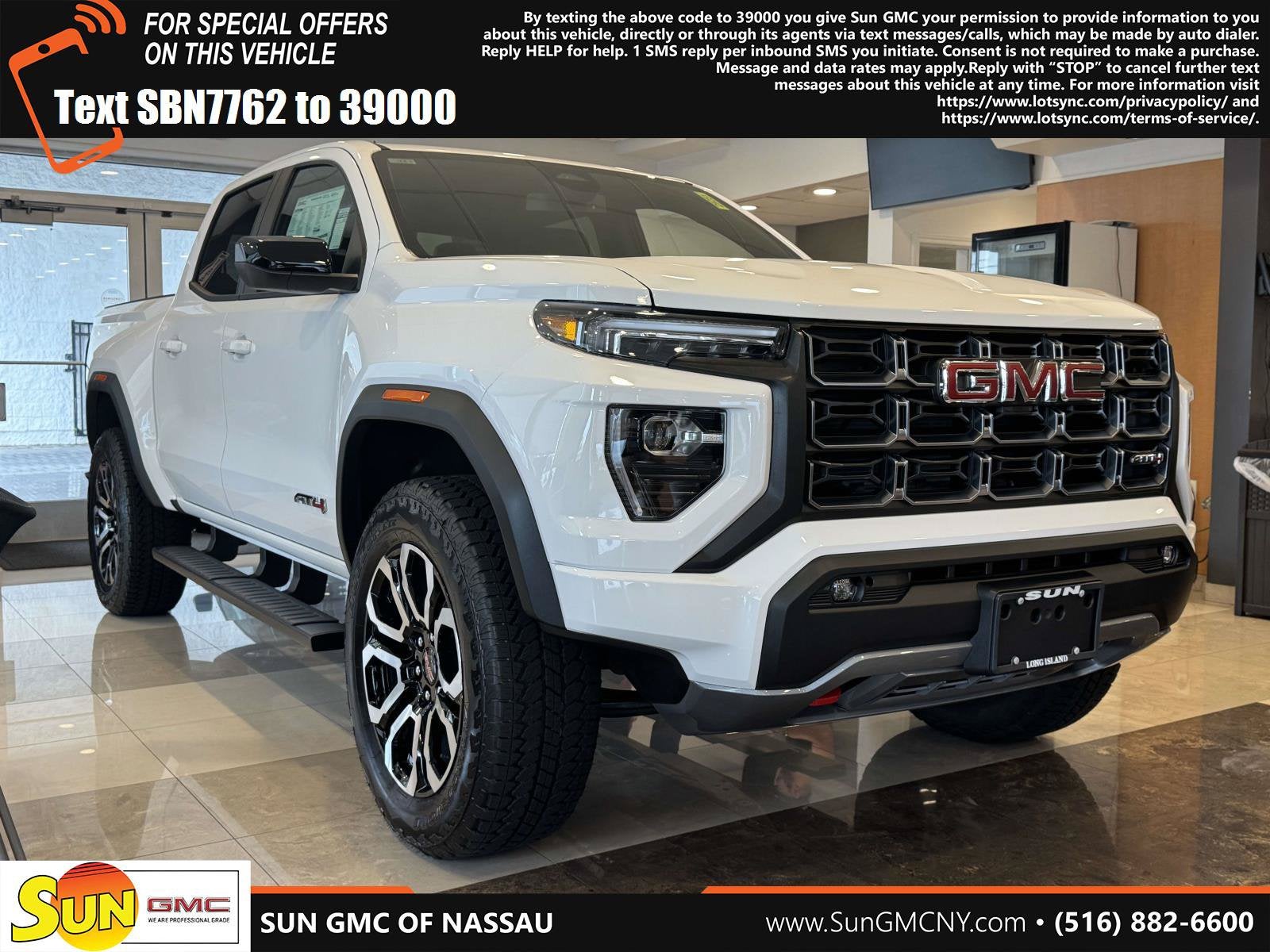 2026 GMC Canyon AT4 in Summit White — front three-quarter view